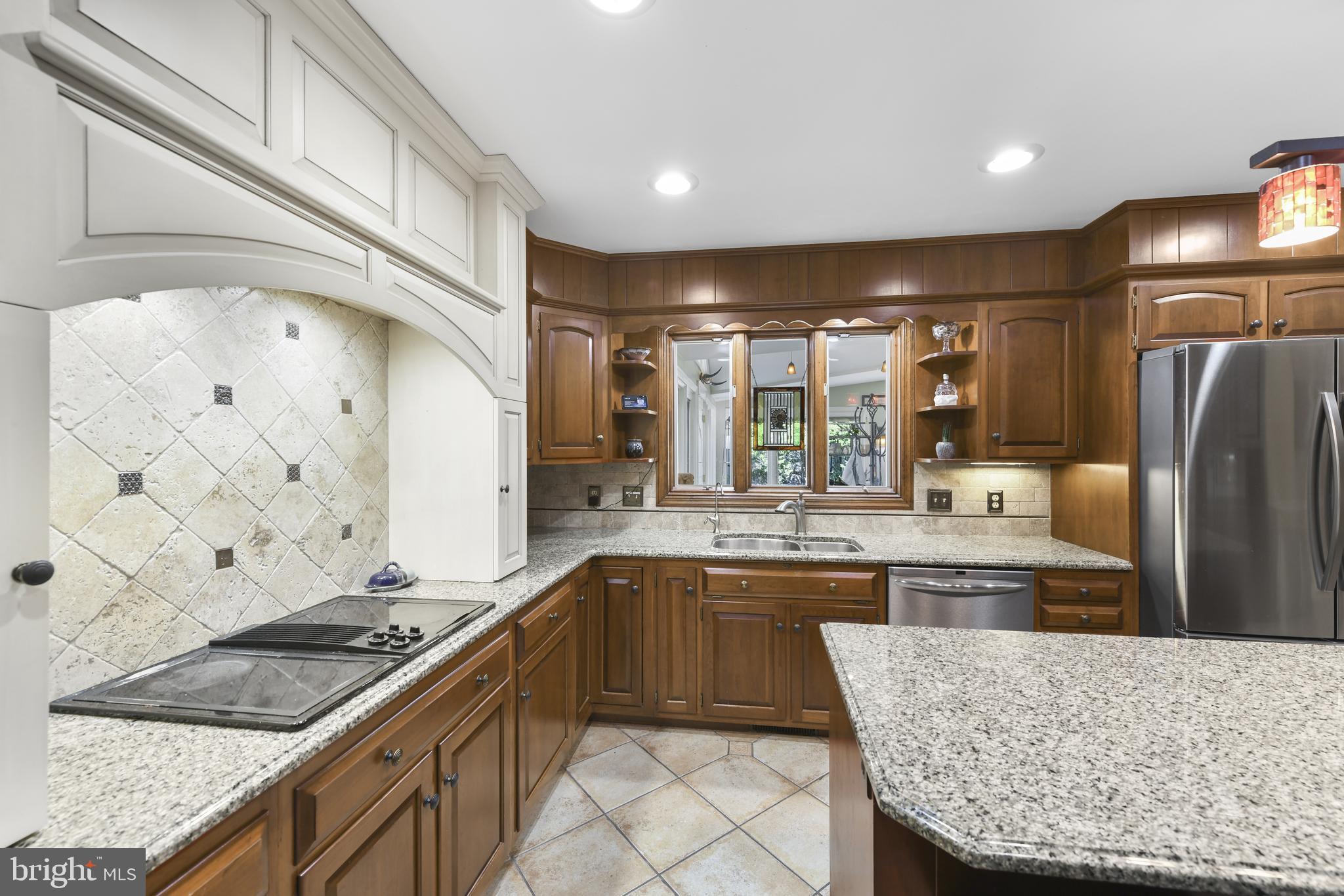 22 Fawn Drive Reading, PA 19607 - Photo 17 of 70 a kitchen with stainless steel appliances granite countertop a sink stove and refrigerator