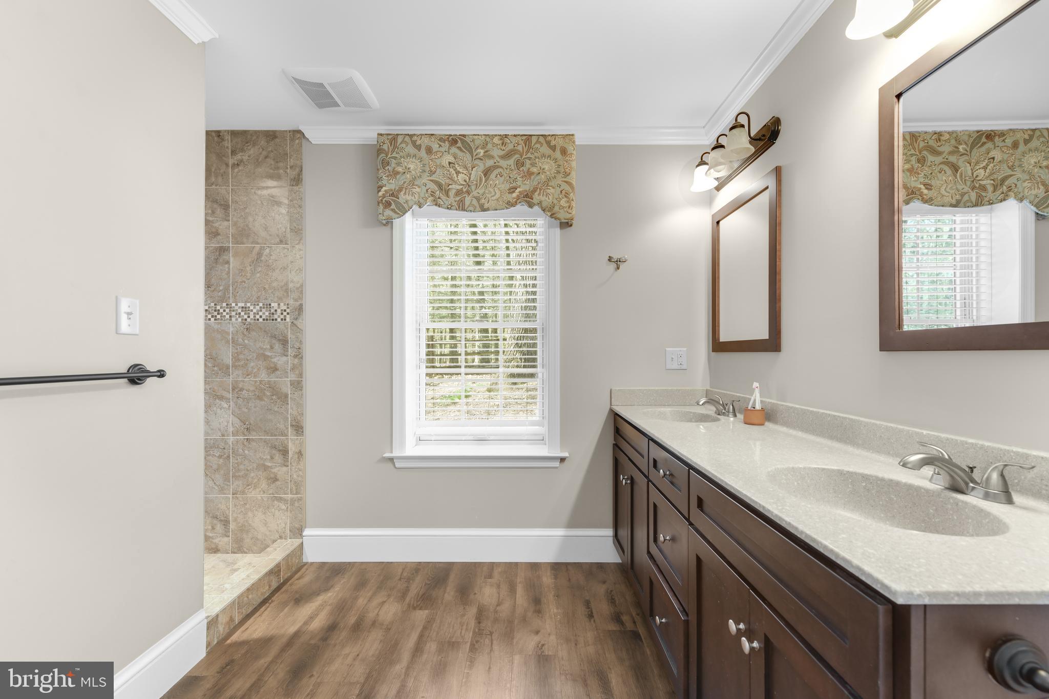 22 Fawn Drive Reading, PA 19607 - Photo 32 of 70 a bathroom with a sink double vanity granite tub and a mirror