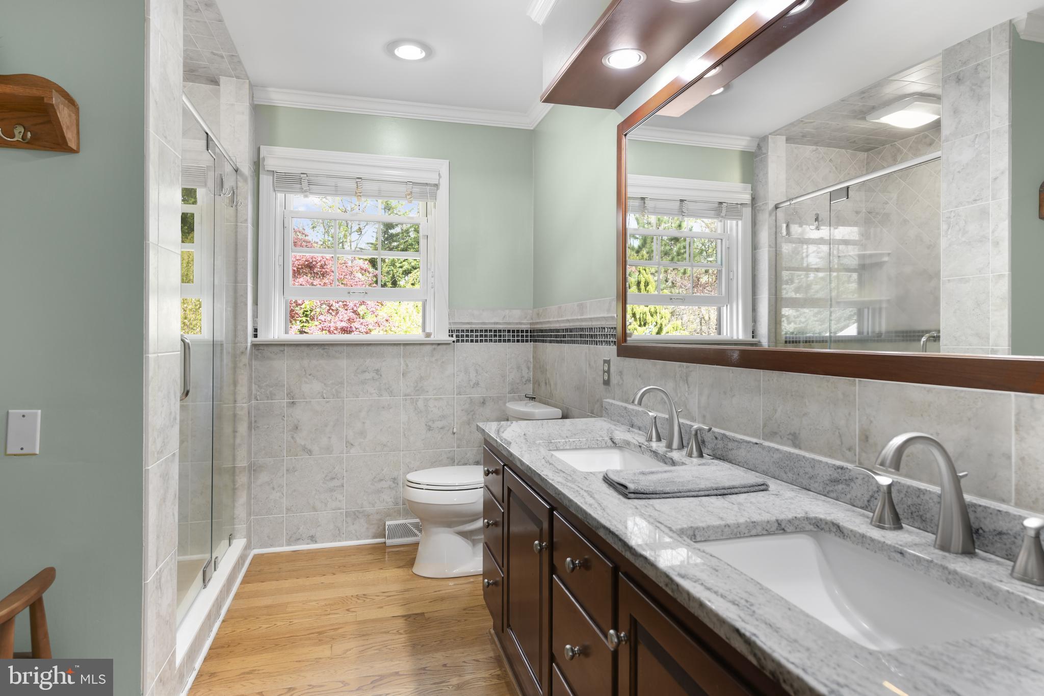 22 Fawn Drive Reading, PA 19607 - Photo 37 of 70 a bathroom with a granite countertop sink a toilet and a mirror