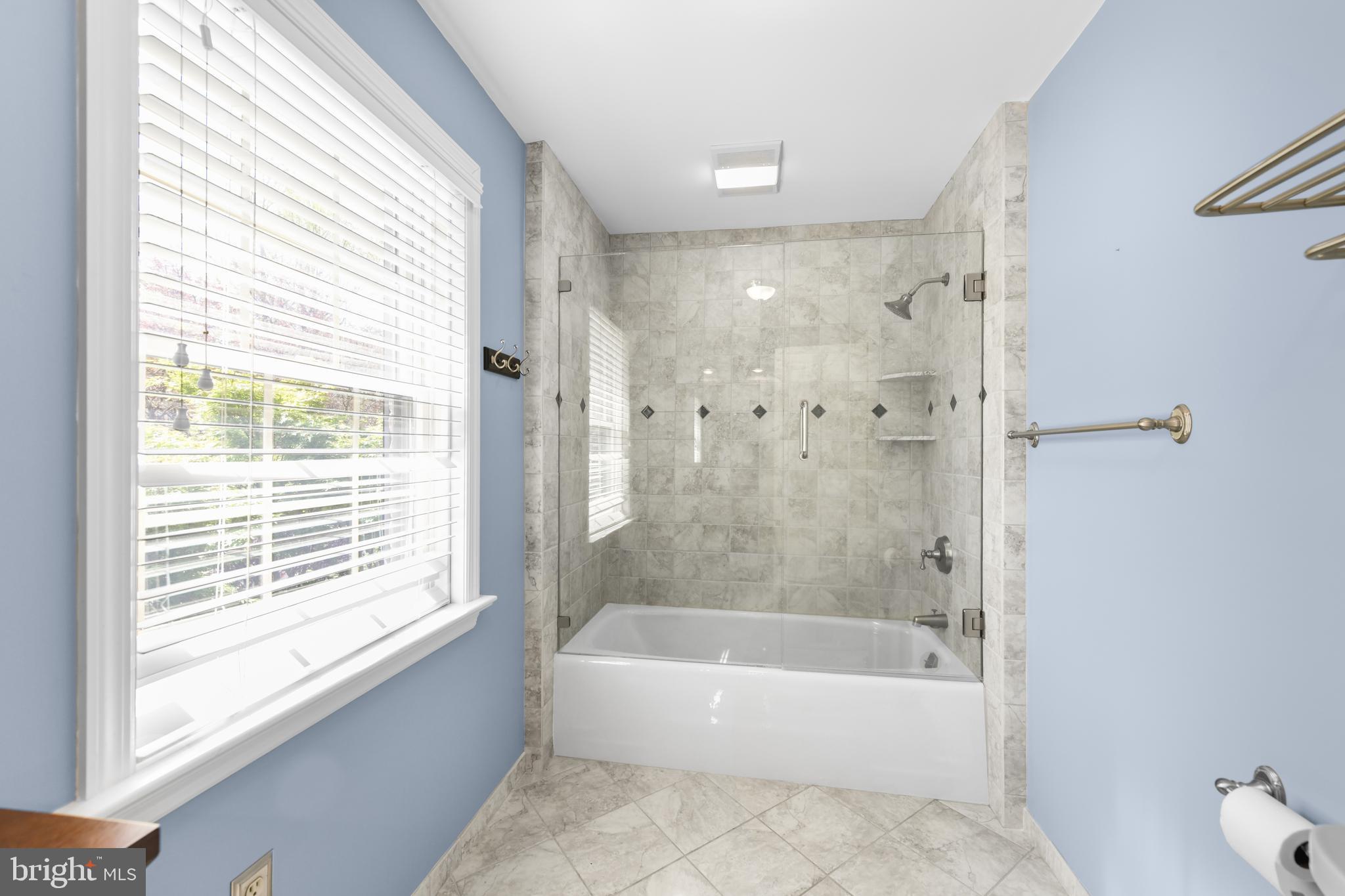 22 Fawn Drive Reading, PA 19607 - Photo 44 of 70 a bathroom with a bathtub a shower and a window