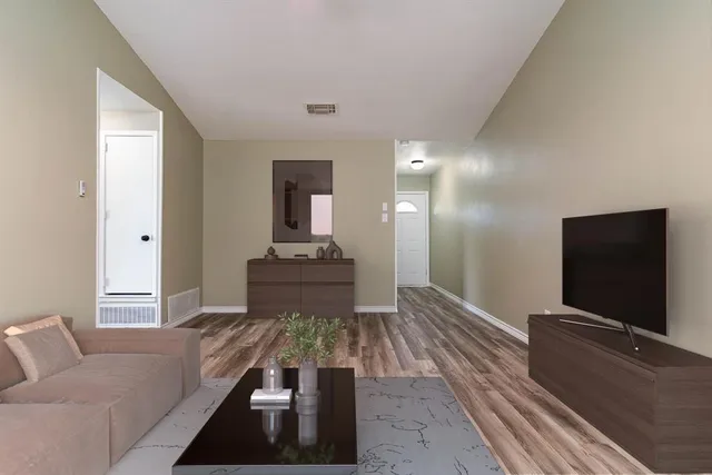 a living room with a couch and a flat screen tv
