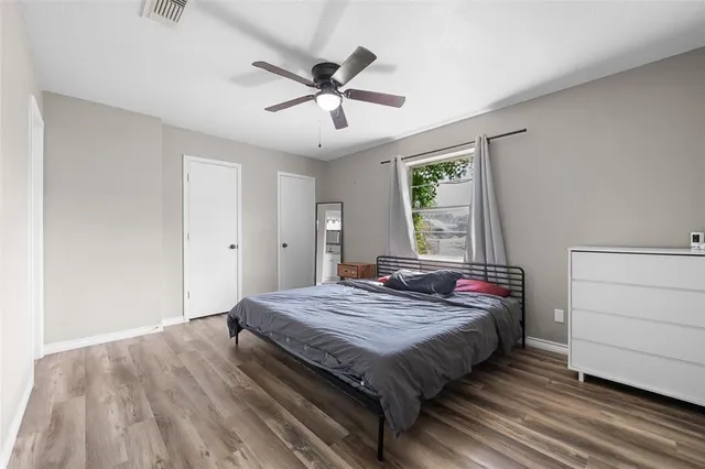 a bedroom with a bed and a dresser