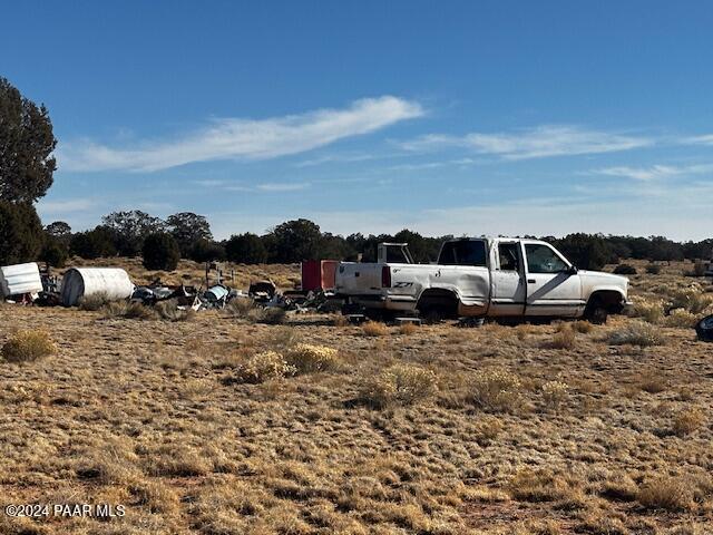 234- Brothers Road Seligman, AZ 86337 - Photo 11 of 16 a row of car parked in front of a house