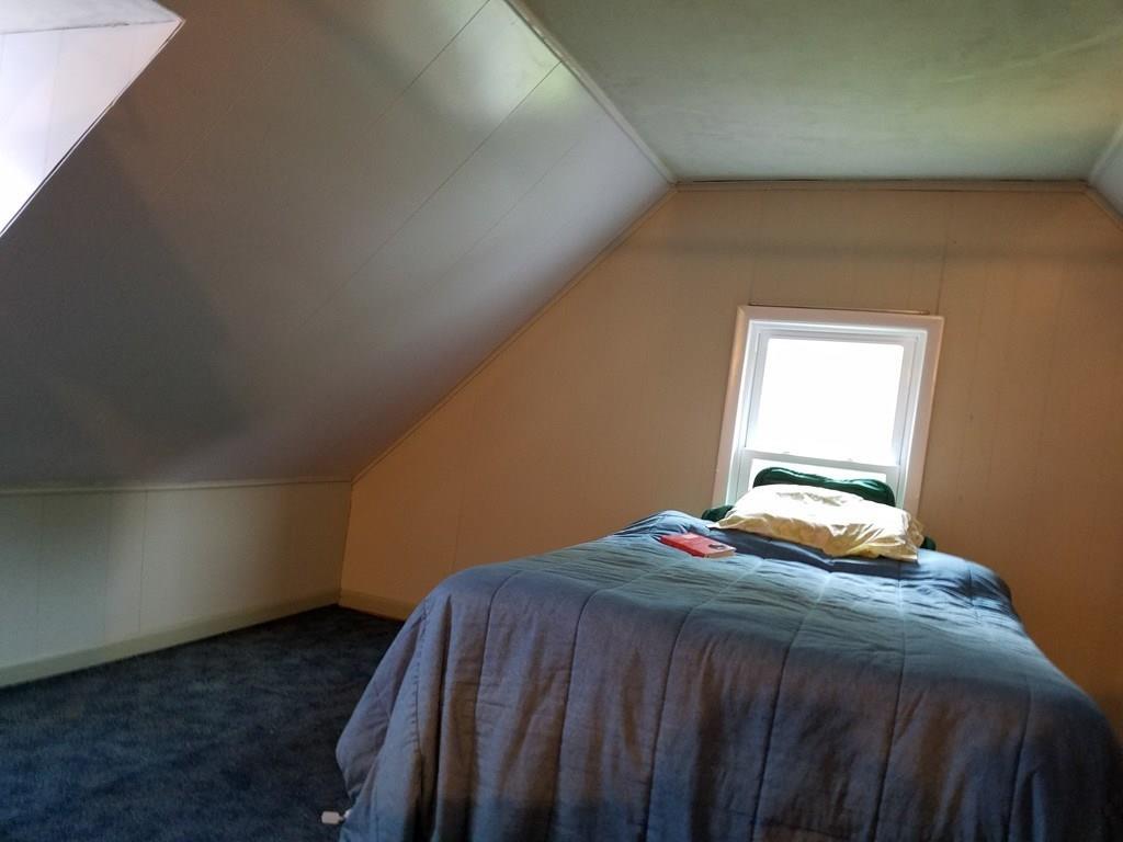 298 Deerfield Street Greenfield, MA 01301 - Photo 13 of 13 a bedroom with a bed and a window