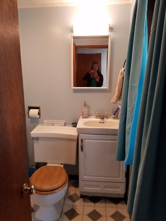 298 Deerfield Street Greenfield, MA 01301 - Photo 8 of 13 a bathroom with a toilet and a sink