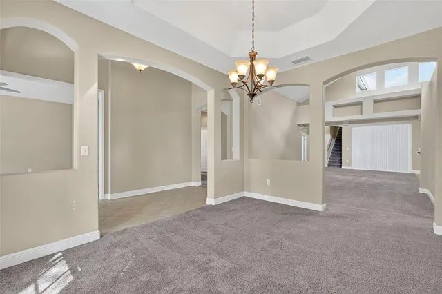 an empty room with a bathroom and a shower