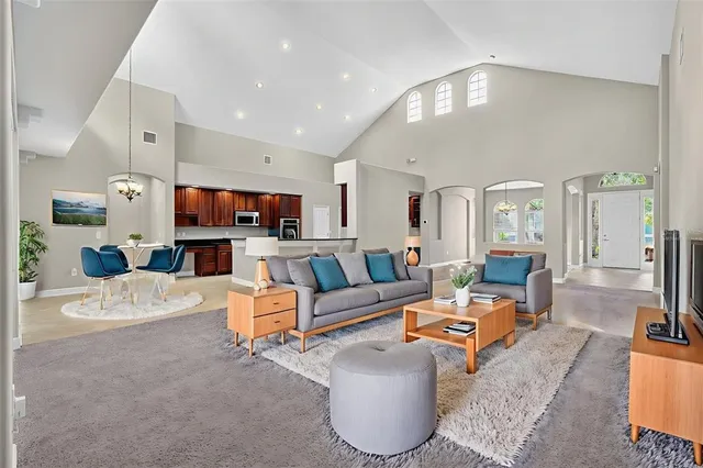 a living room with fireplace furniture and a flat screen tv