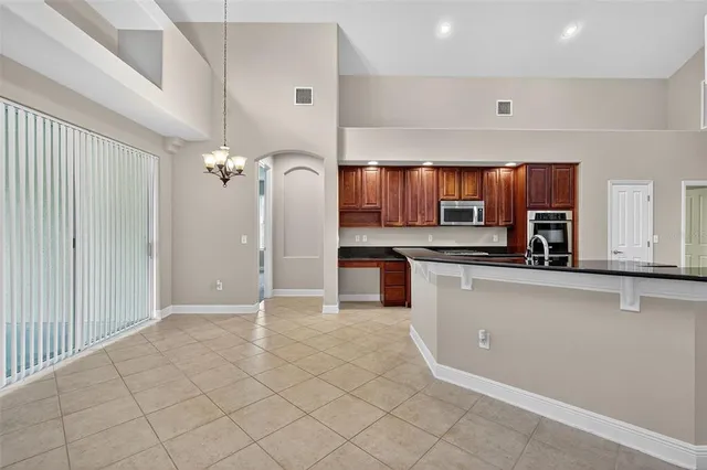 a kitchen with stainless steel appliances a refrigerator sink and cabinets