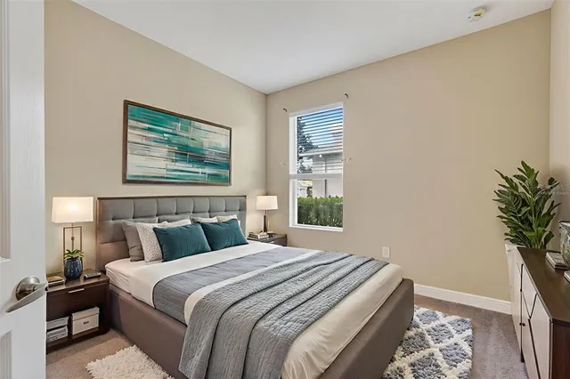 a bedroom with bed and window