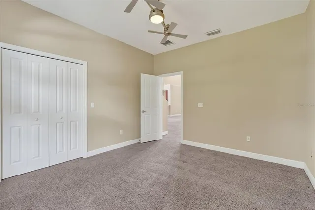 a view of an empty room and a window