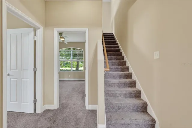 a view of a hallway with staircase