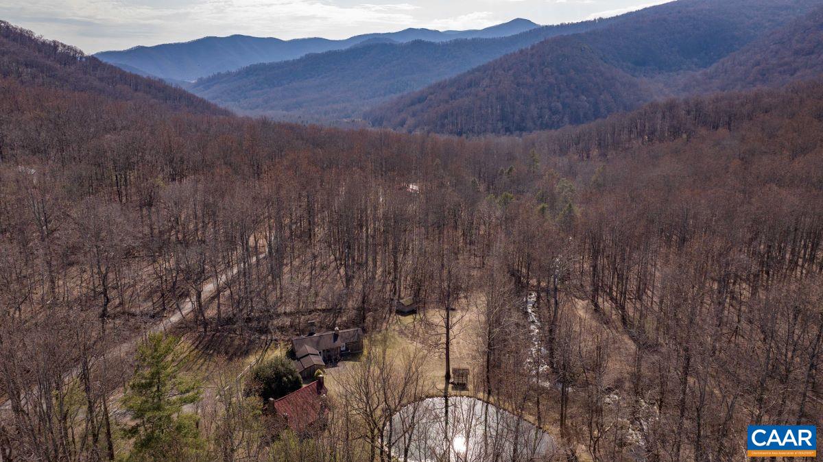 4873 Weakley Hollow Road Syria, VA 22743 - Photo 11 of 38 a view of a house with a mountain and yard