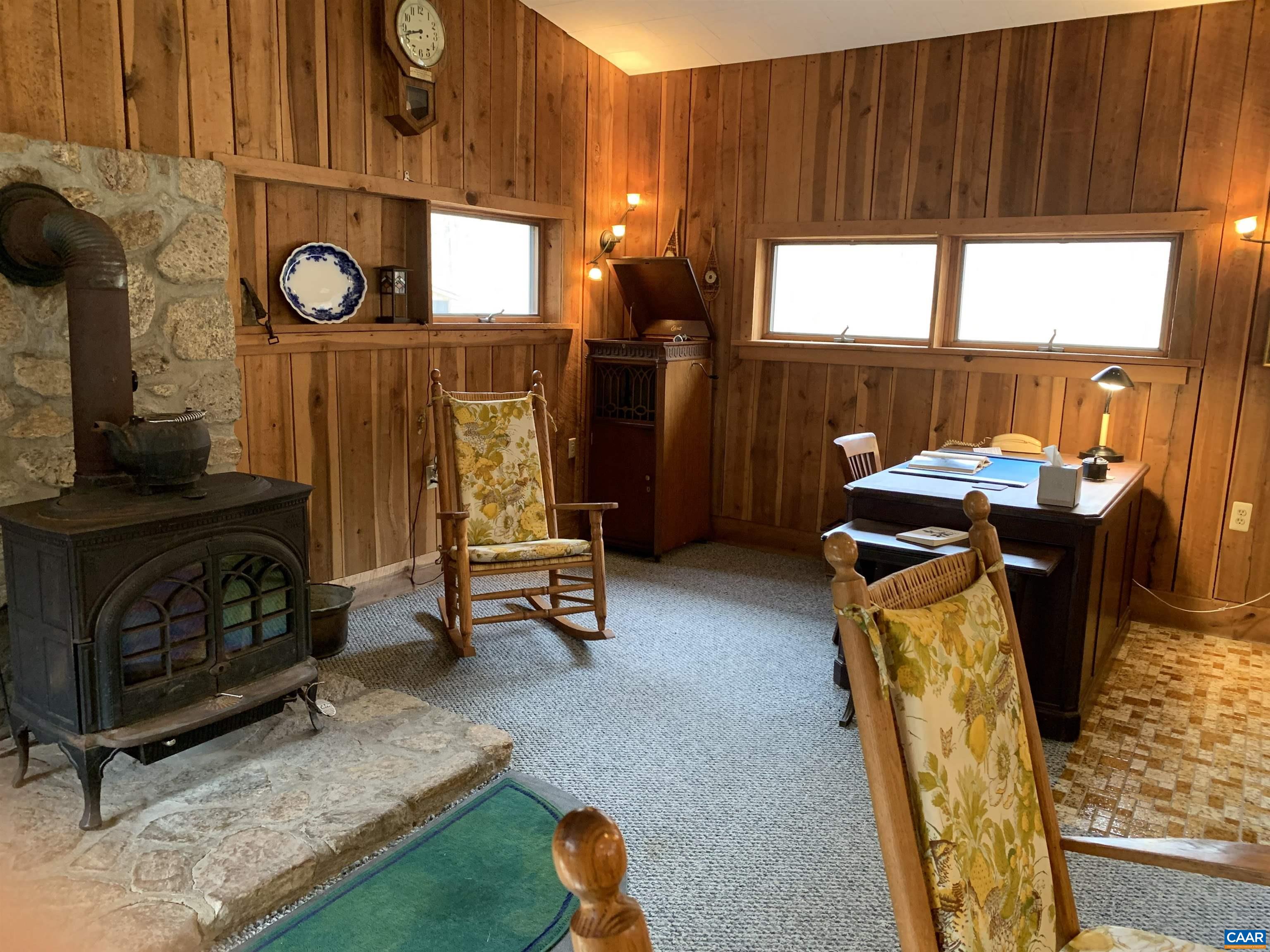 4873 Weakley Hollow Road Syria, VA 22743 - Photo 15 of 38 a living room with furniture a window and wooden floor