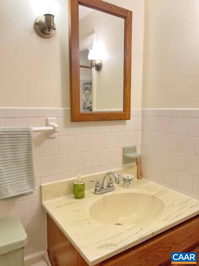 4873 Weakley Hollow Road Syria, VA 22743 - Photo 23 of 38 a bathroom with a sink and a mirror