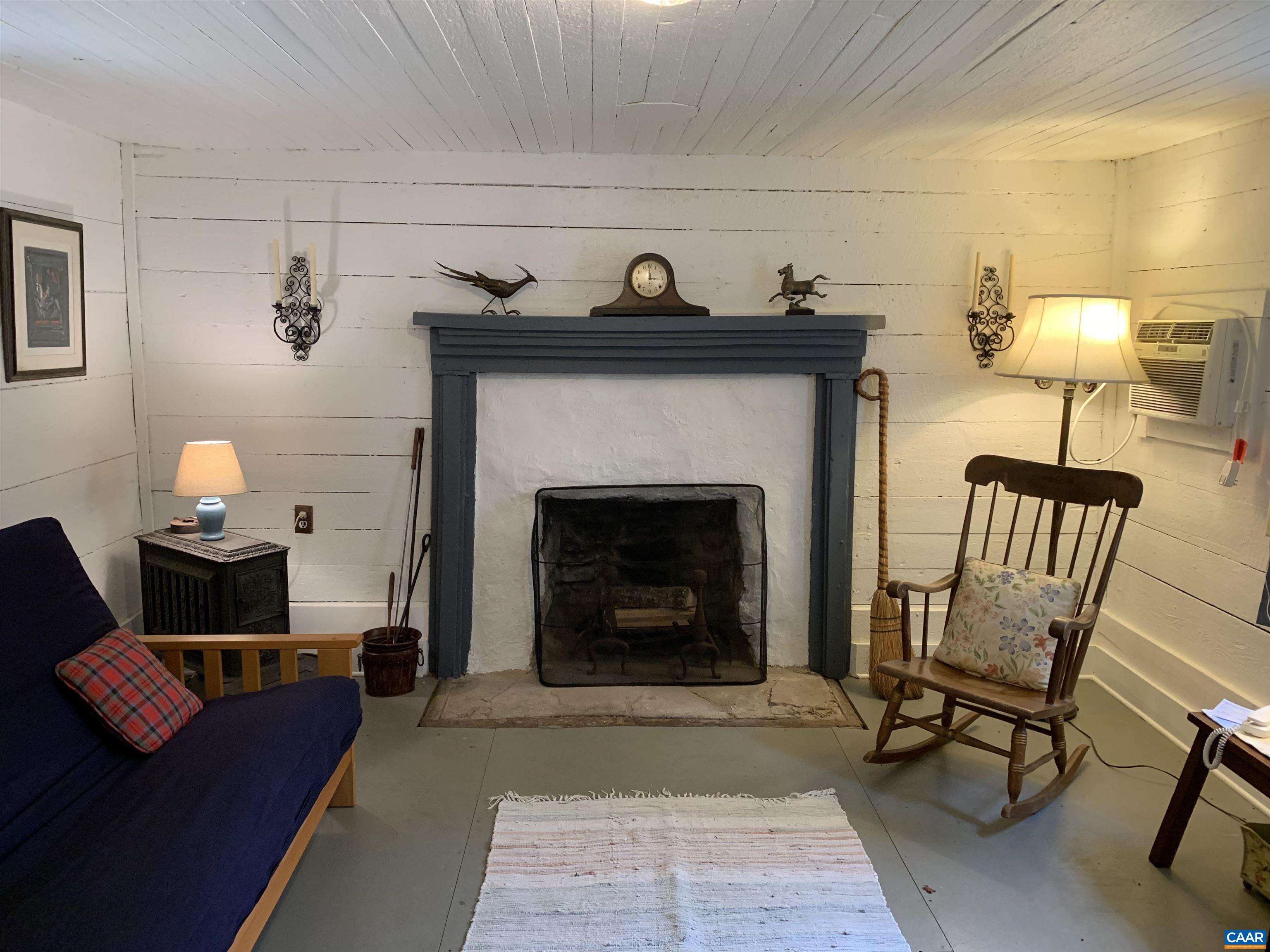 4873 Weakley Hollow Road Syria, VA 22743 - Photo 25 of 38 a living room with furniture and a fireplace