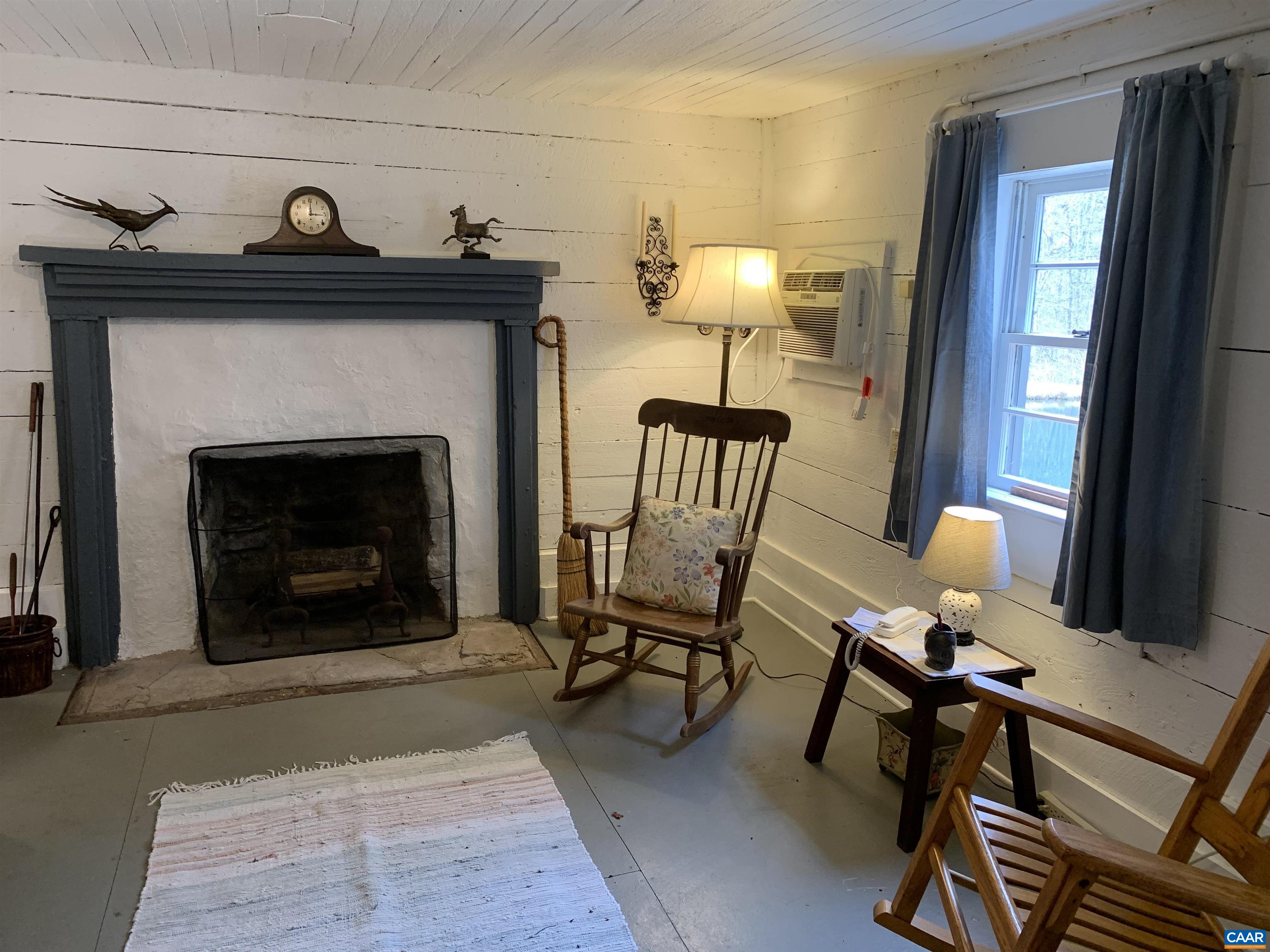 4873 Weakley Hollow Road Syria, VA 22743 - Photo 26 of 38 a living room with furniture and a fireplace