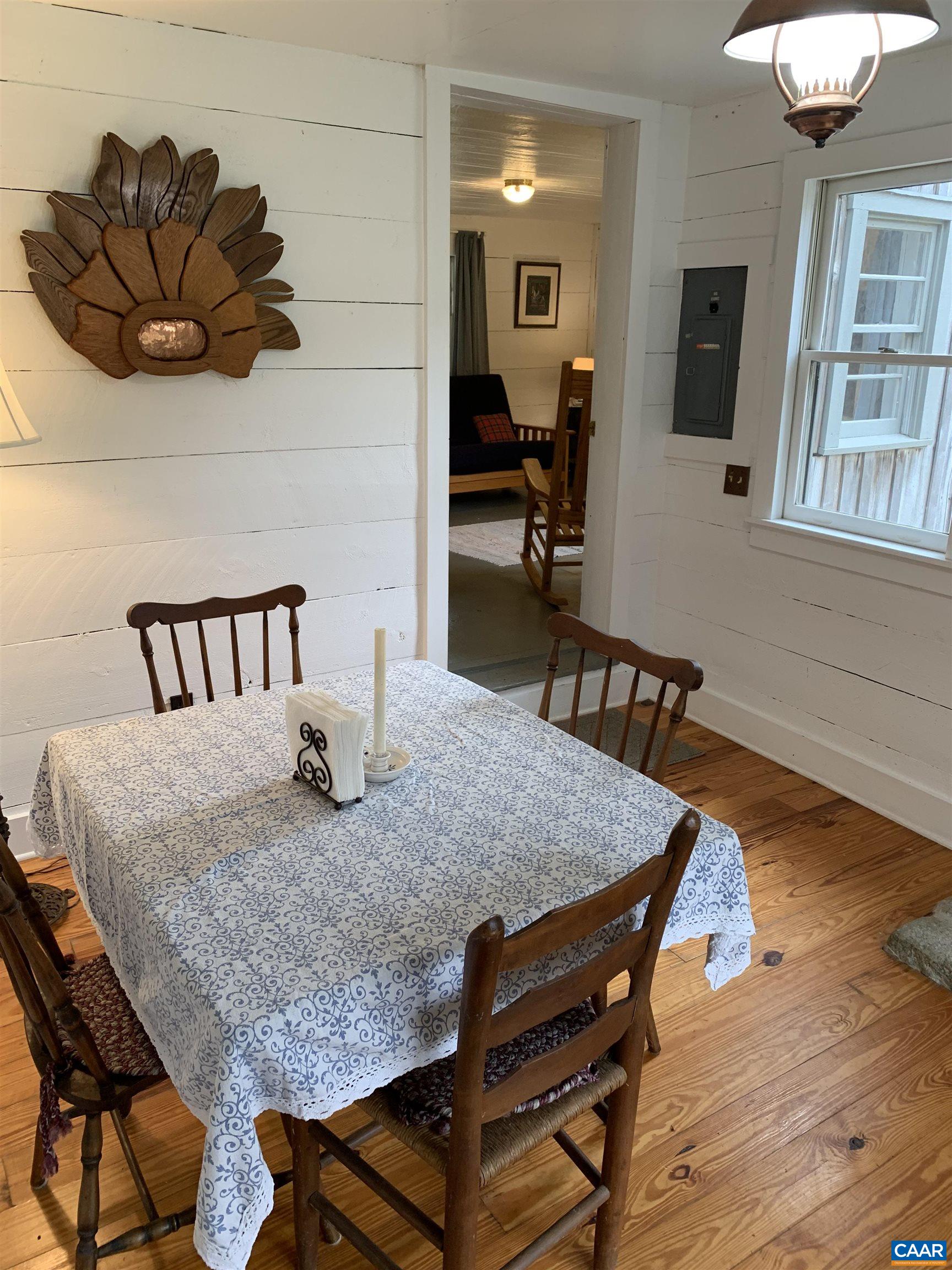 4873 Weakley Hollow Road Syria, VA 22743 - Photo 32 of 38 a view of a dining room with furniture and a chandelier