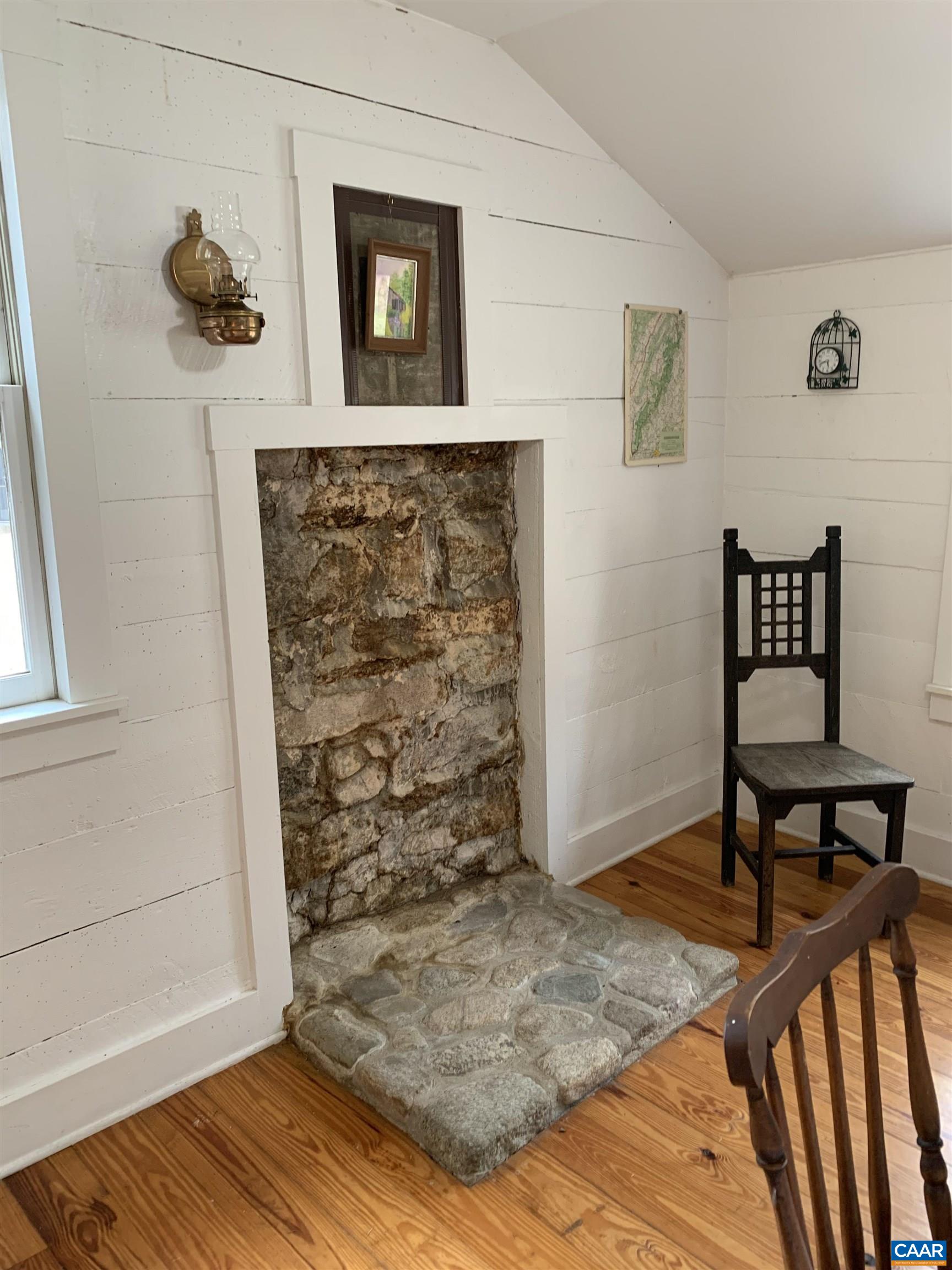 4873 Weakley Hollow Road Syria, VA 22743 - Photo 33 of 38 a view of a livingroom with wooden floor and a potted plant