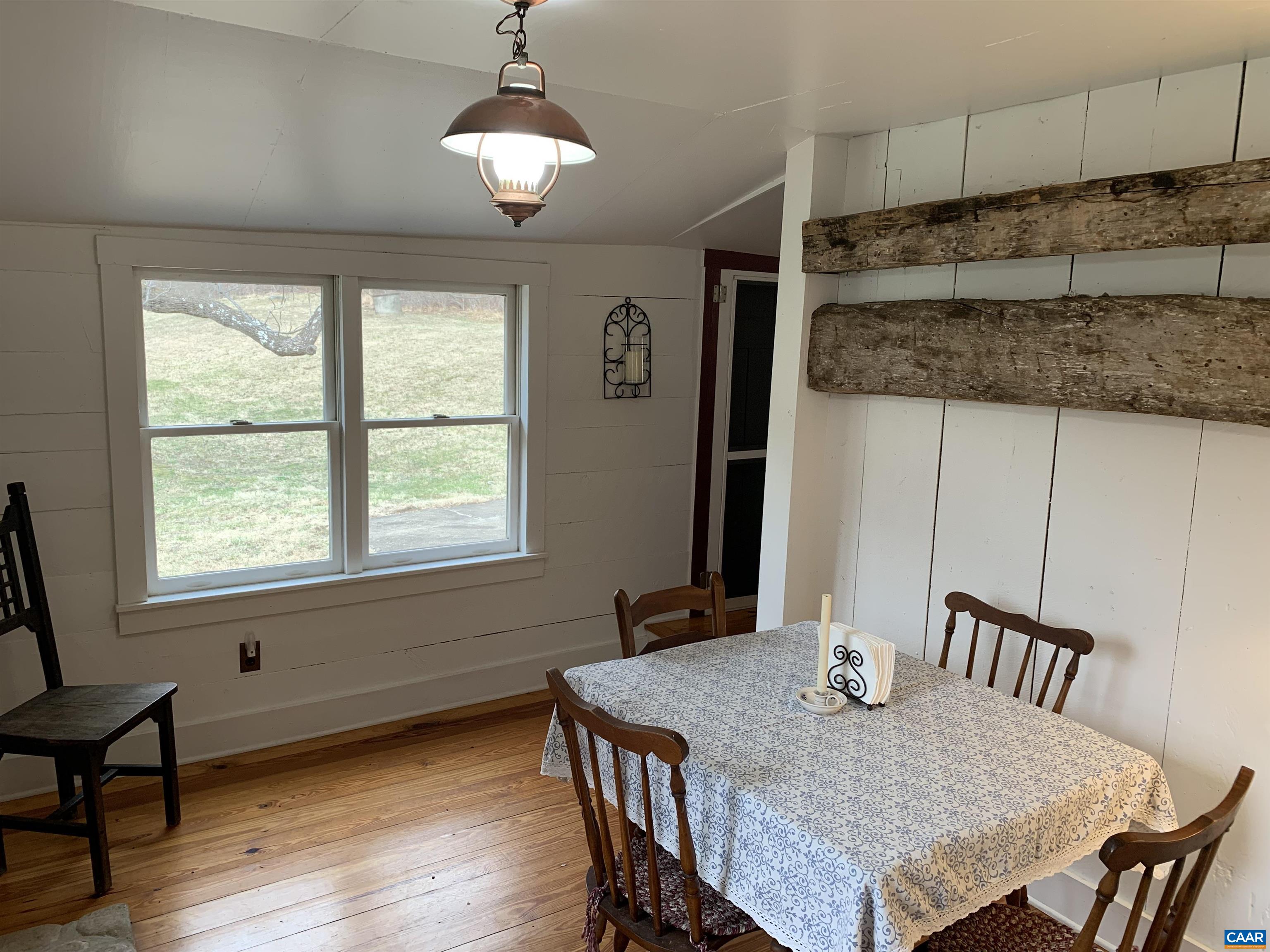 4873 Weakley Hollow Road Syria, VA 22743 - Photo 34 of 38 a view of a dining room with furniture window and wooden floor