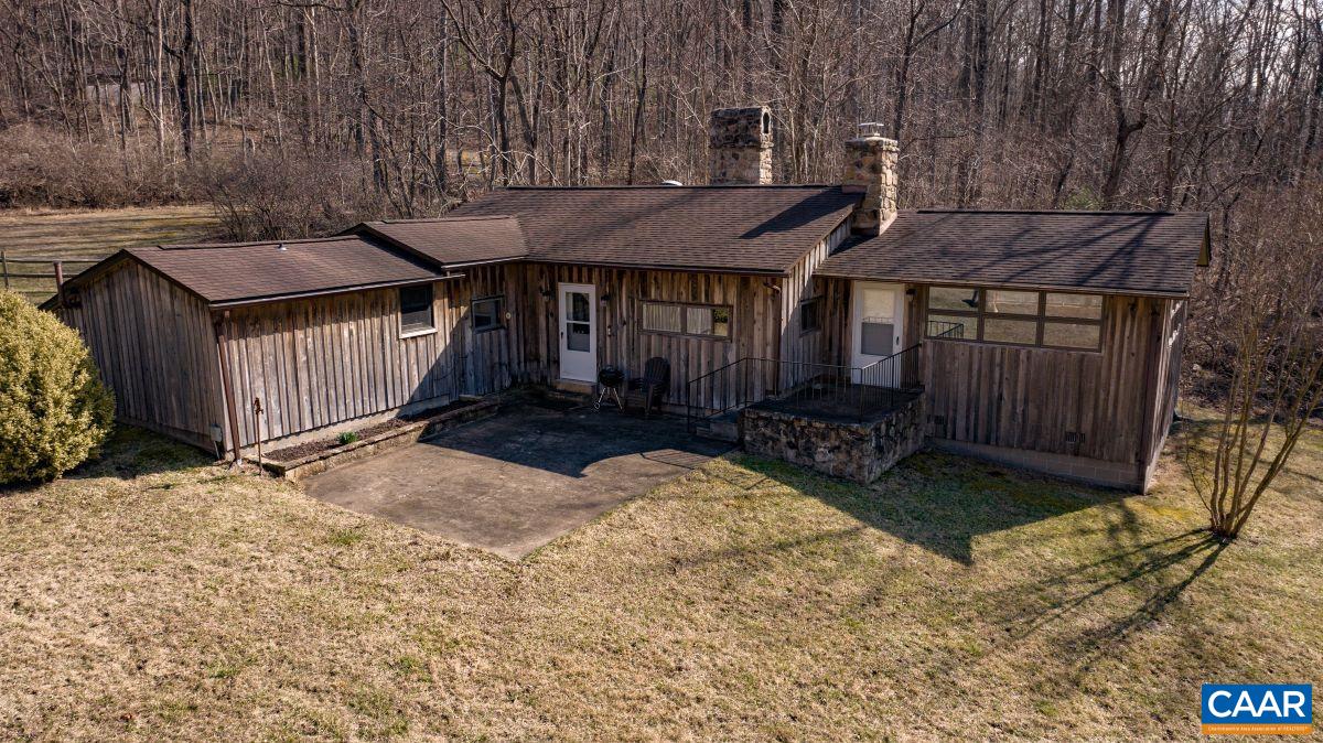 4873 Weakley Hollow Road Syria, VA 22743 - Photo 5 of 38 a view of a wooden house with a yard