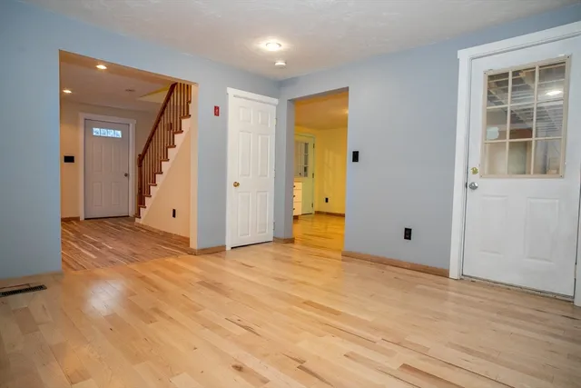 a room with a dresser and a window