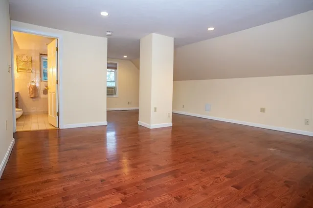 a bathroom with a shower and a toilet