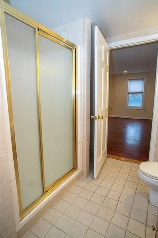 a bathroom with a sink mirror and a bathtub