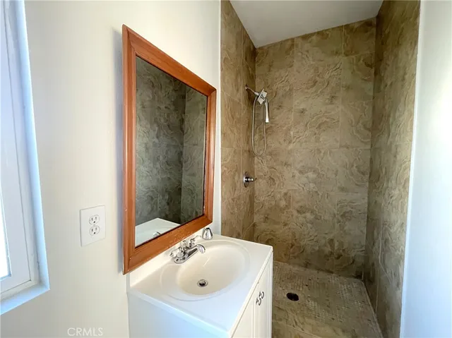 a bathroom with a sink and shower