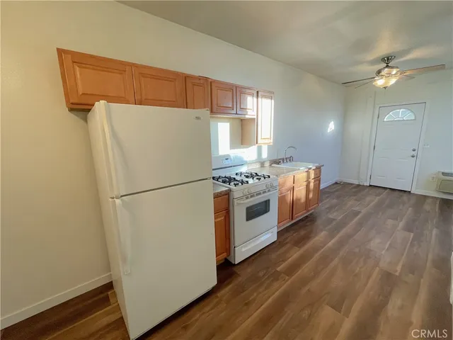 a white refrigerator freezer sitting inside of a kitchen
