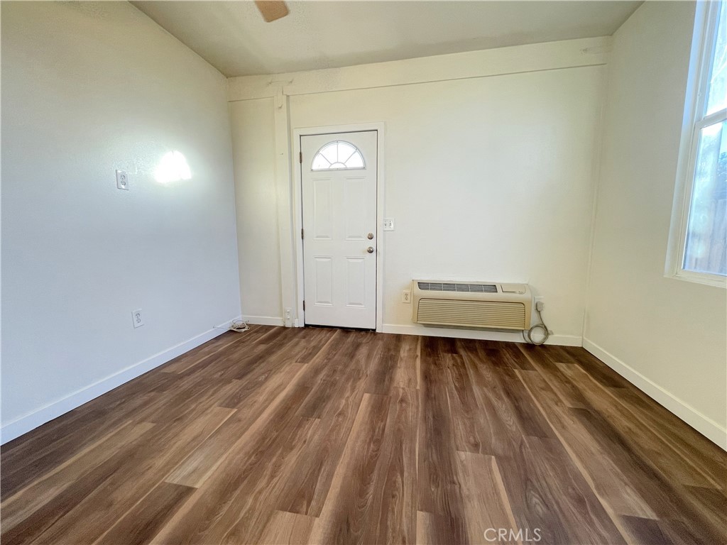 1334 East Brockton Avenue, Unit B Redlands, CA 92374 - Photo 7 of 14 a view of a room with wooden floor and a window