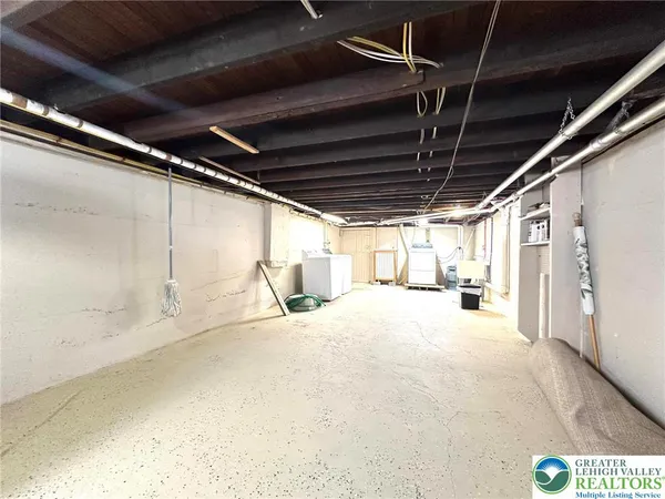 a view of a room with wooden walls