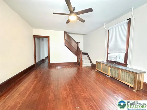 a view of an entryway with wooden floor