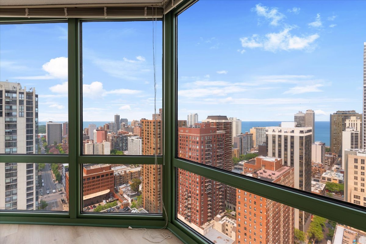 111 West Maple Street, Unit 3001 Chicago, IL 60610 - Photo 3 of 13 a view of city from a balcony