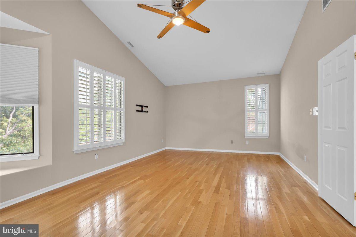 5 Promenade Place Voorhees, NJ 08043 - Photo 8 of 24 a view of empty room with wooden floor and fan