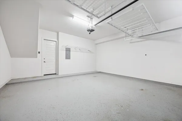 a front view of a building with garage