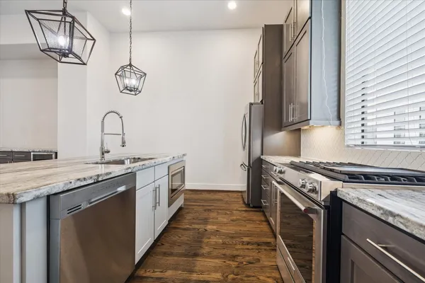 a kitchen with a stove and a sink