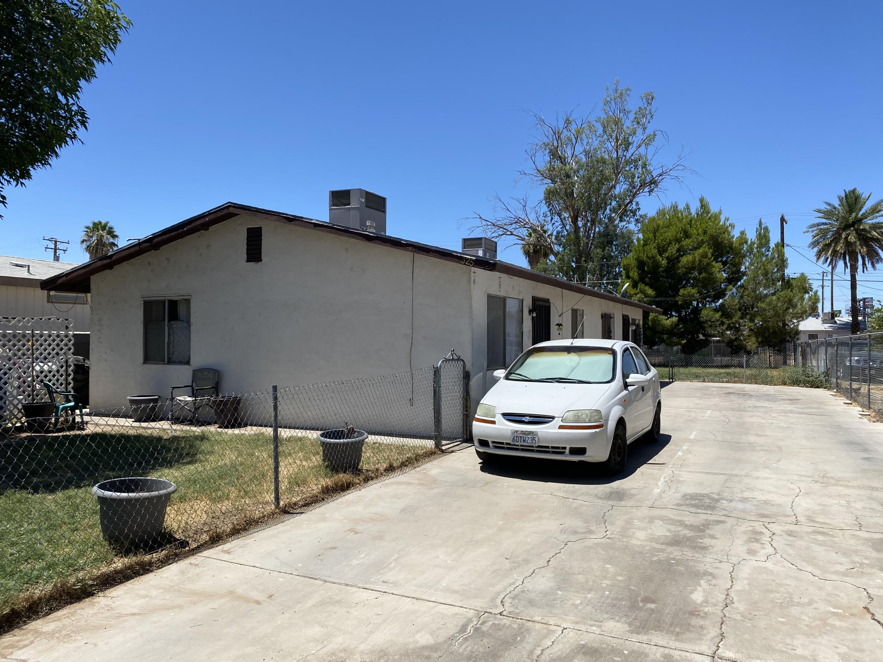325 South Spring Street Blythe, CA 92225 - Photo 9 of 10 a front view of a house with a yard