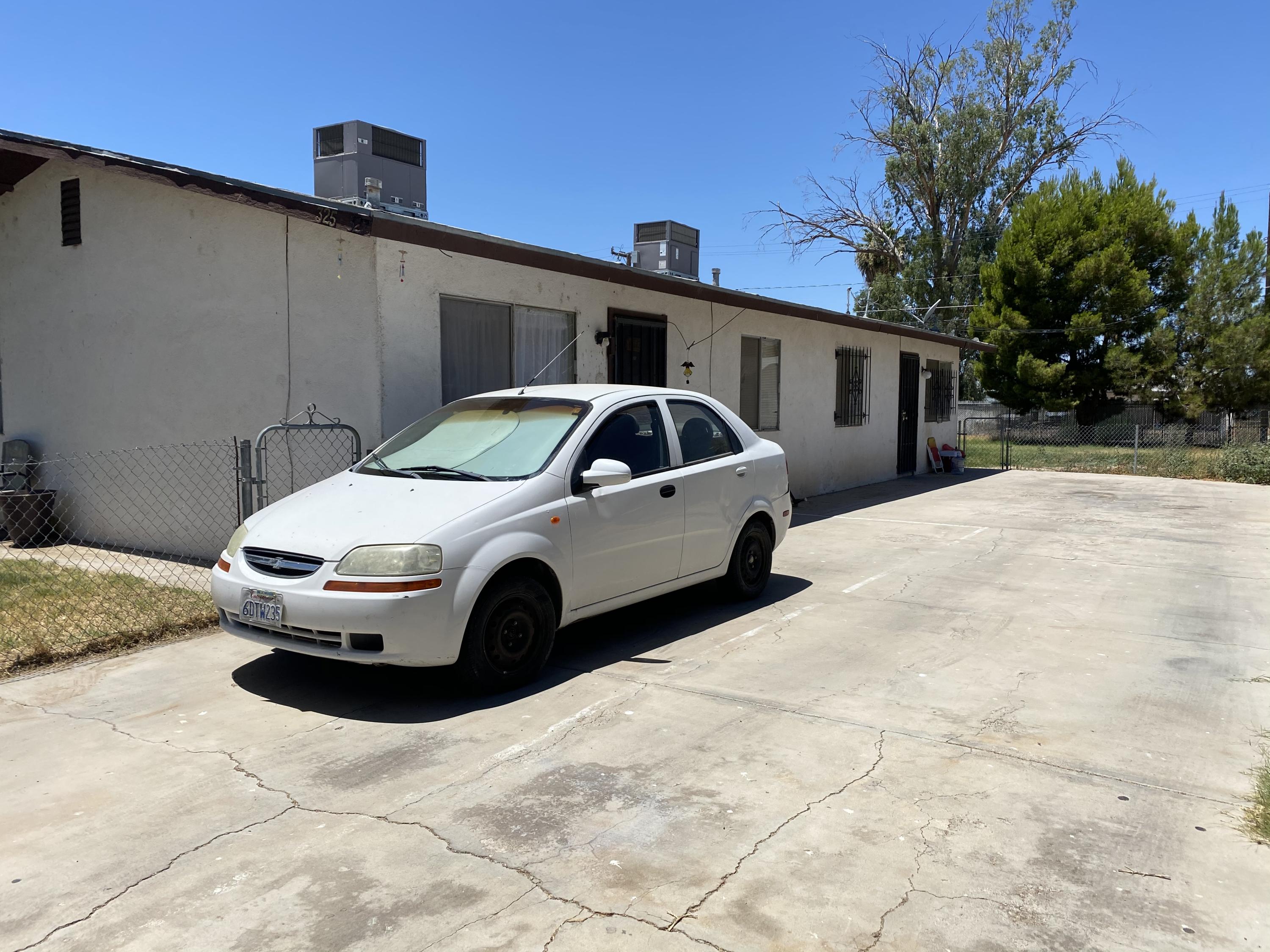325 South Spring Street Blythe, CA 92225 - Photo 10 of 10 a front view of a house with parking space