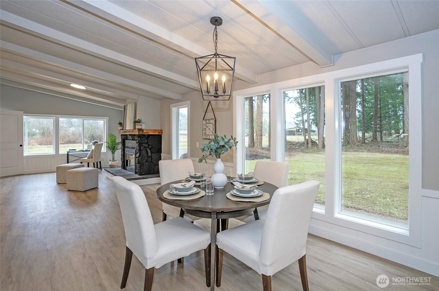 11810 Driver Street Southwest Olympia, WA 98512 - Photo 11 of 40 a view of a dining room with furniture wooden floor and chandelier