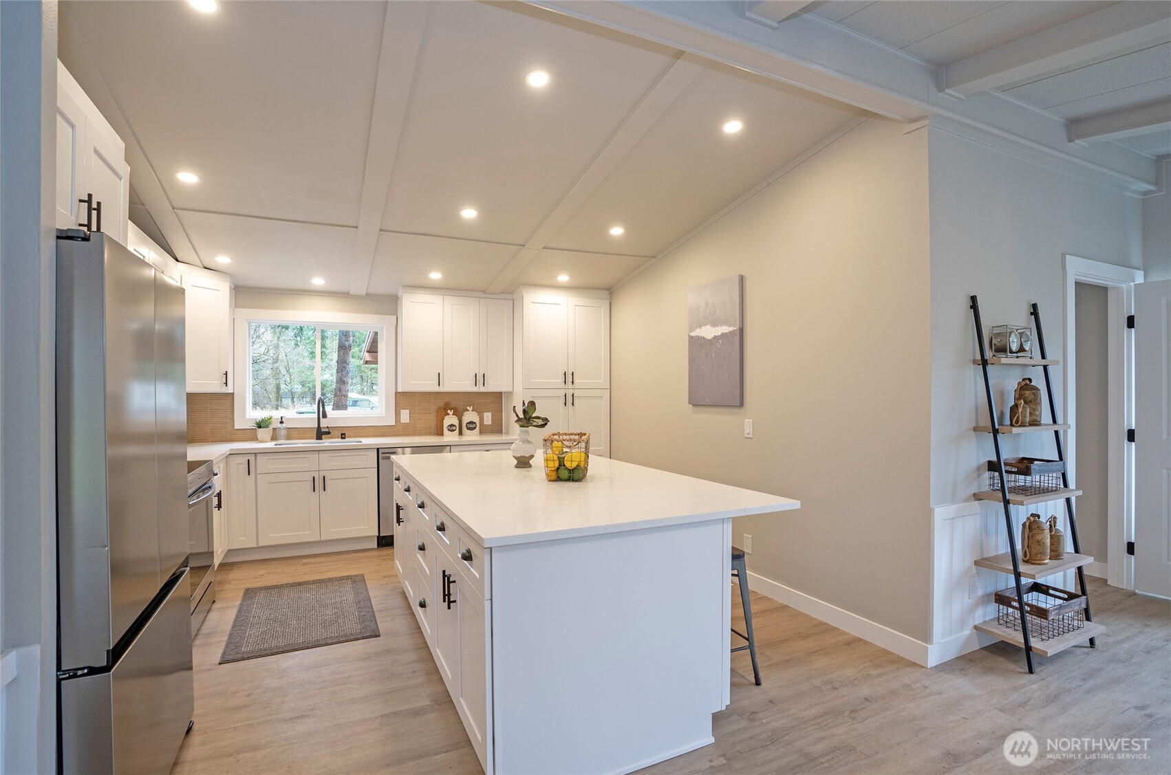 11810 Driver Street Southwest Olympia, WA 98512 - Photo 16 of 40 a kitchen with a sink refrigerator and cabinets