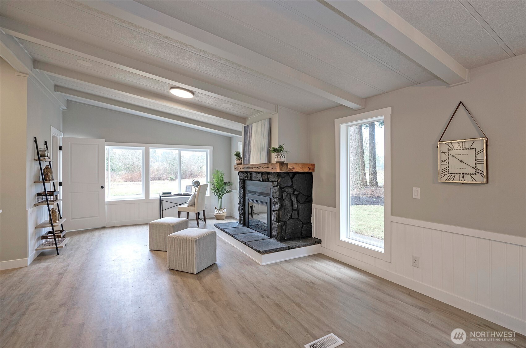 11810 Driver Street Southwest Olympia, WA 98512 - Photo 17 of 40 a living room with furniture and a wooden floor
