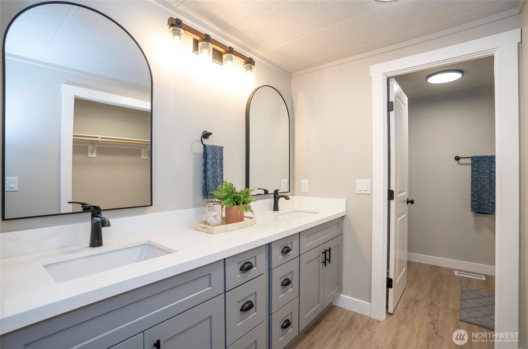 11810 Driver Street Southwest Olympia, WA 98512 - Photo 23 of 40 a bathroom with a double vanity sink and mirror