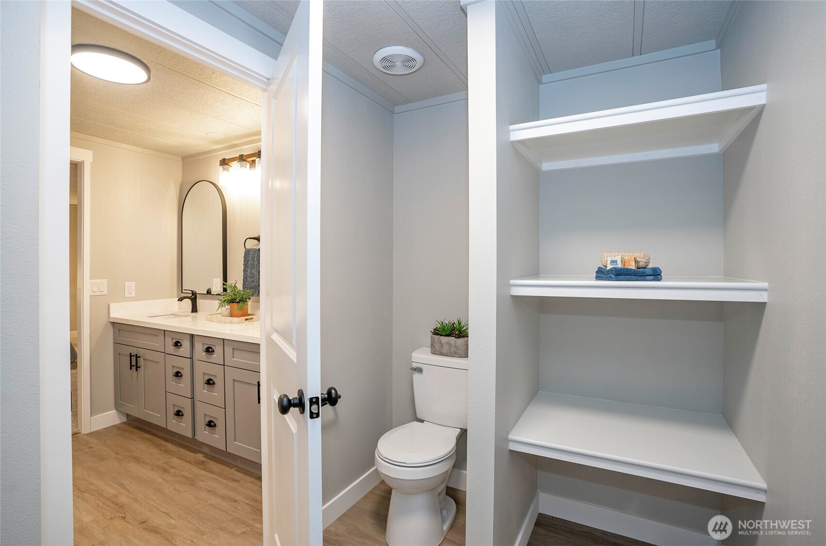 11810 Driver Street Southwest Olympia, WA 98512 - Photo 26 of 40 a bathroom with a sink a toilet and a mirror