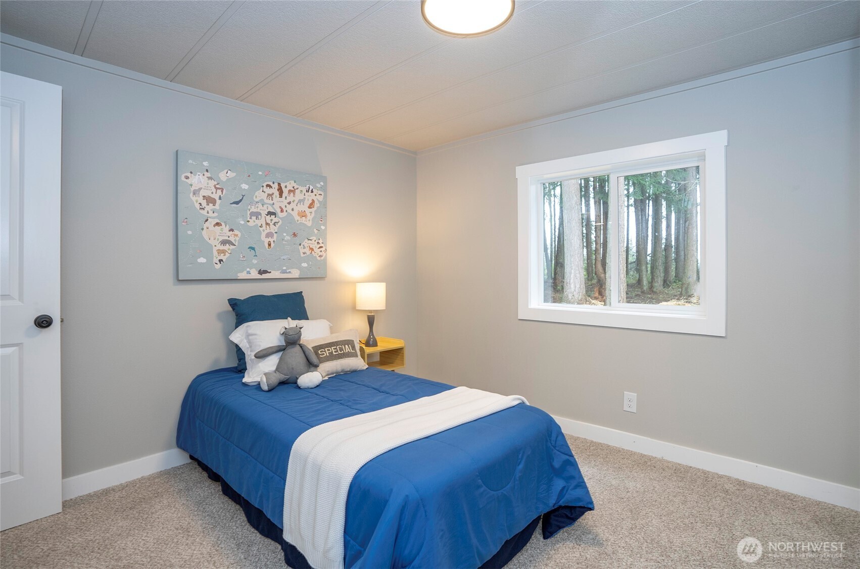 11810 Driver Street Southwest Olympia, WA 98512 - Photo 28 of 40 a bedroom with a bed and a window