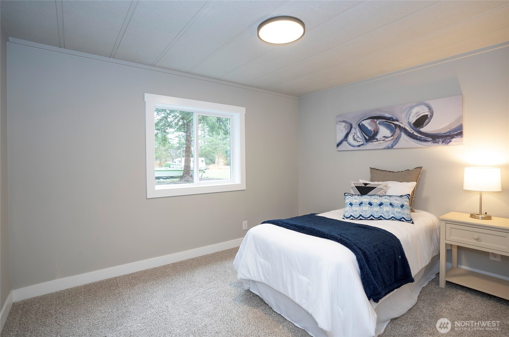 11810 Driver Street Southwest Olympia, WA 98512 - Photo 29 of 40 a bedroom with a bed and a window