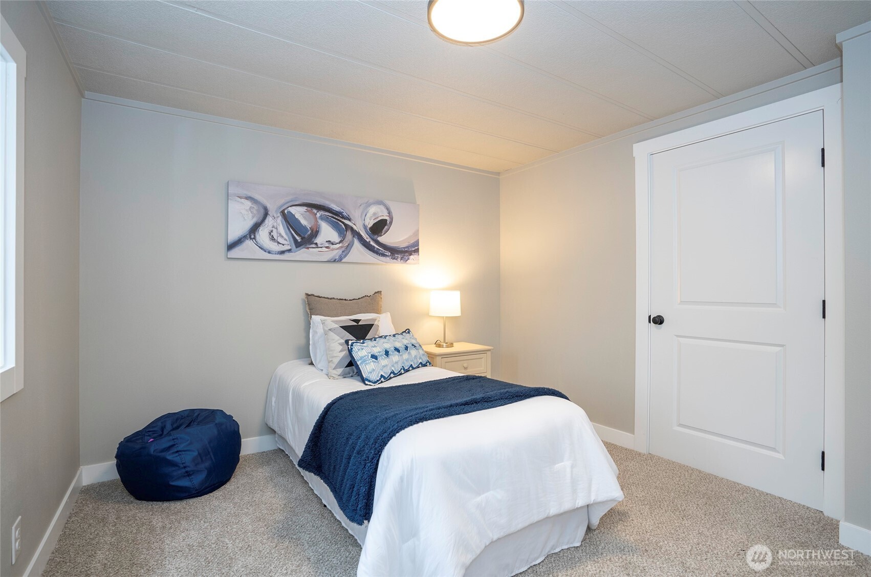 11810 Driver Street Southwest Olympia, WA 98512 - Photo 30 of 40 a bedroom with a bed and painting on the wall