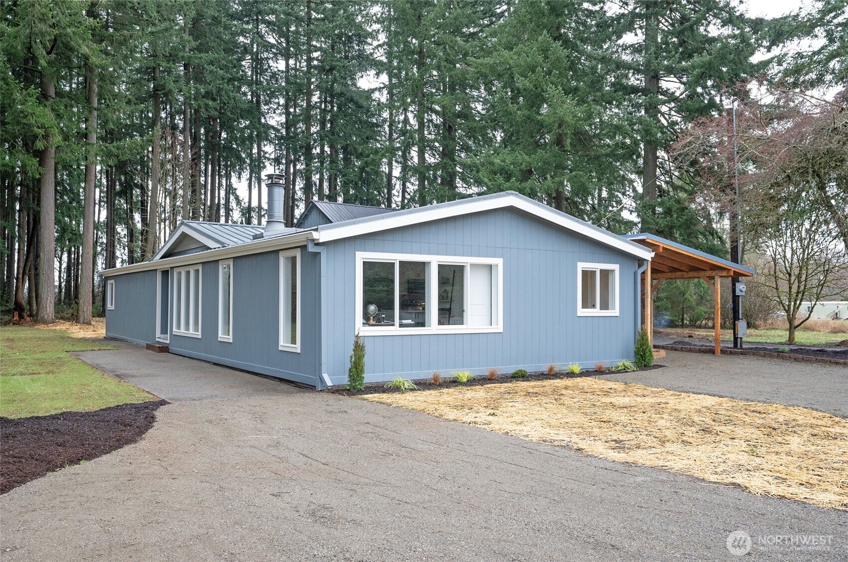 11810 Driver Street Southwest Olympia, WA 98512 - Photo 3 of 40 a view of a house with a yard covered in snow