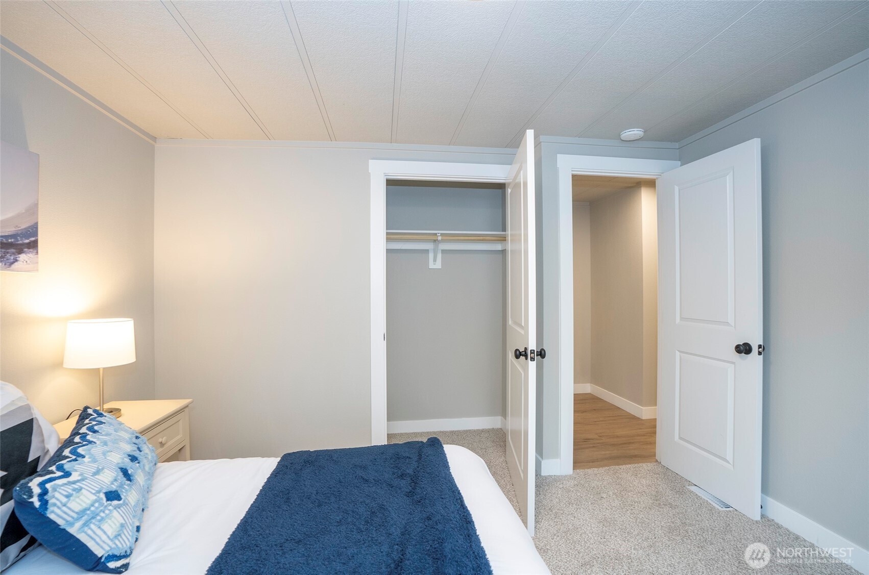 11810 Driver Street Southwest Olympia, WA 98512 - Photo 31 of 40 a bedroom with a bed and a lamp