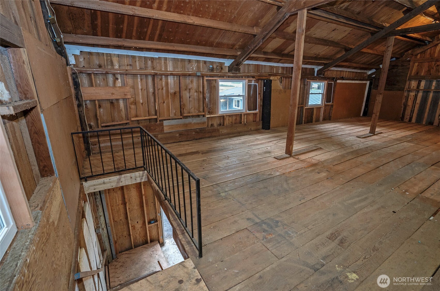11810 Driver Street Southwest Olympia, WA 98512 - Photo 37 of 40 a view of staircase with wooden floor and chair