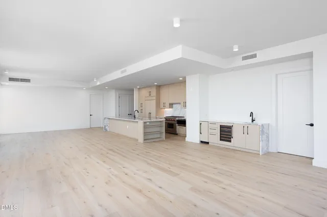 a view of a kitchen with wooden floor